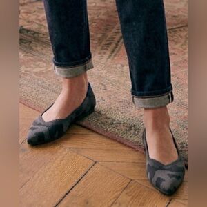 Rothy's The Point flats in a gray/dark camo print with blue trim. 
Size 6